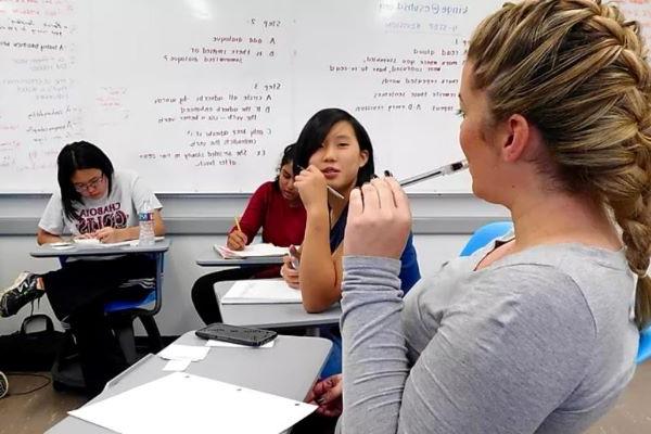 Students discussing in class.